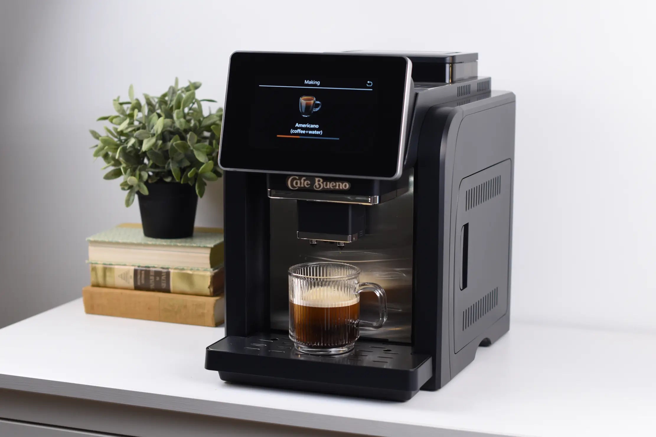 Cafe Bueno CB-3500 espresso and cappuccino machine sitting on a desk with a rich cup of coffee with thick layer of crema.