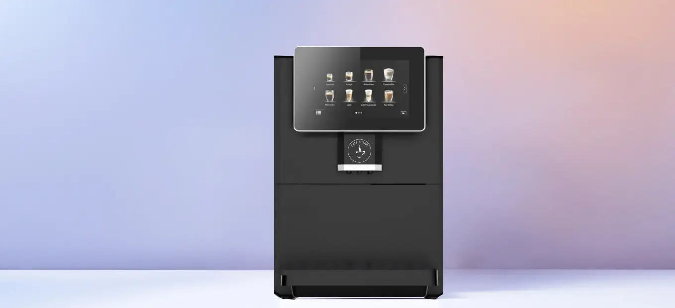Cafe Bueno super automatic espresso machine front view in matte black with touchscreen displaying espresso lungo americano cappuccino macchiato latte latte macchiato and flat white drink options, Cafe Bueno logo on dispenser, against a soft blue and pink gradient studio background.